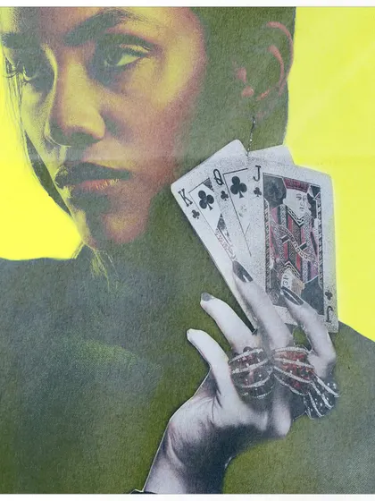 A close-up portrait with a high-contrast, yellow-toned filter, where the model holds playing cards. The collage style and bold color treatment give the image a pop-art feel, exploring themes of chance and identity.