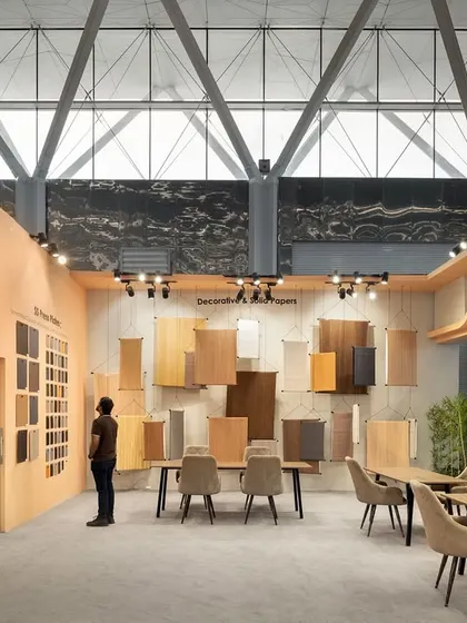 Inside the Ambica exhibition stall, we designed a gallery-like space for displaying decorative and solid papers. The products are hung like works of art, allowing visitors to appreciate the textures and finishes in a calm, curated setting.