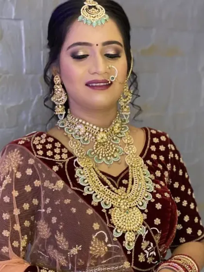 For a royal look, this heavy layered mint green set was rented to match a deep red velvet lehenga. The set includes a choker, a long rani haar, and a matching maang tikka.