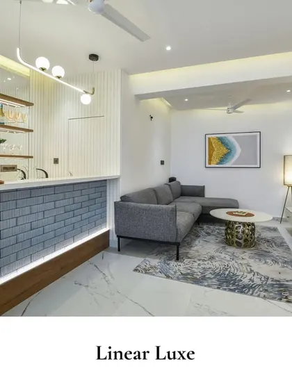 Linear elements and sleek finishes define this modern bar and lounge. The design focuses on clean geometry and soft lighting to achieve a luxurious yet functional space.