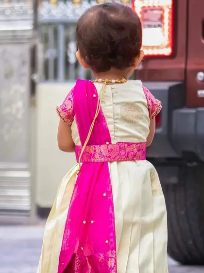 I always pay attention to the back of the outfit. Here you can see the neat finish and the simple tie-up detail, along with a small drape that gives it the look of a half-saree.