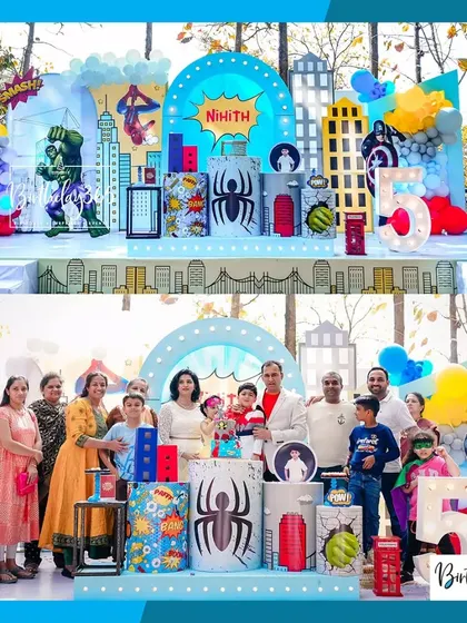 The birthday boy and his family celebrating his 5th birthday in front of the action-packed superhero stage we created.