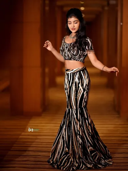 A dynamic shot that captures movement and attitude. The composition and pose give this traditional outfit a very modern and edgy vibe.