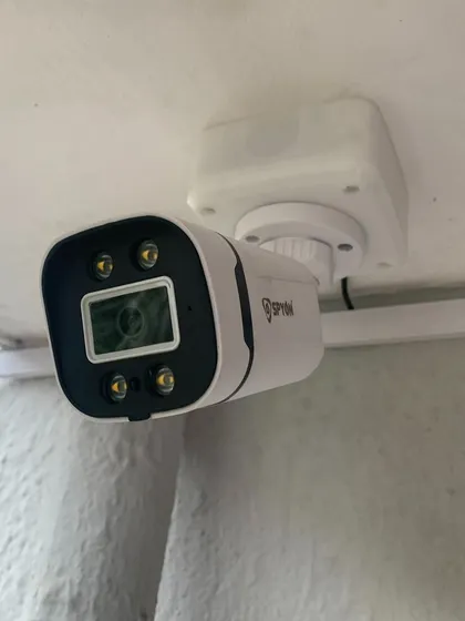 A close-up of a modern outdoor camera, designed to be both effective and discreet.