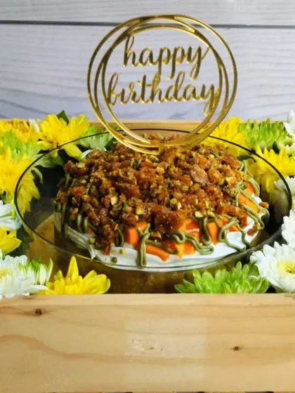 For a tropical twist, I created this Mango Pistachio Tres Leches Hamper. The cake is soaked in three milks and bursting with mango flavor, topped with a crunchy pistachio praline and presented in a wooden crate with fresh flowers.