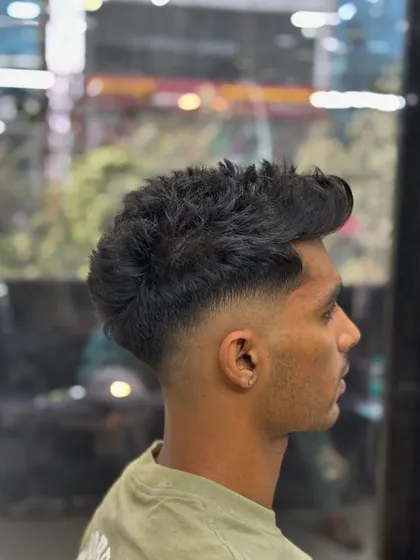 The final look of the high skin fade and textured crop. A versatile haircut for any occasion.