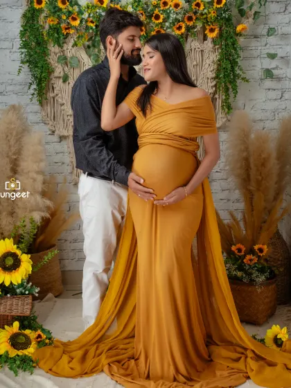 We love capturing the connection between expecting parents. This couple's maternity shoot features our popular boho-chic setup with sunflowers and macrame, creating a warm and intimate portrait.