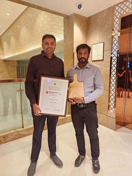 My chef and I with our "Best Dessert Parlour of the Year" award. This journey started with the two of us, and this recognition means the world.