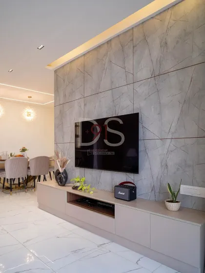 A different angle of the TV unit, showing its integration with the dining area in the background.