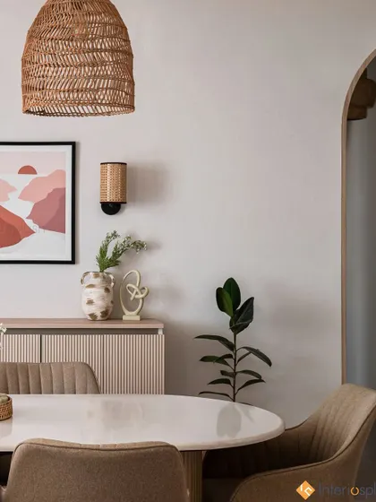 This dining space is defined by its clean lines and natural elements. The woven pendant light and simple artwork create a focal point without overwhelming the serene, minimalist aesthetic.