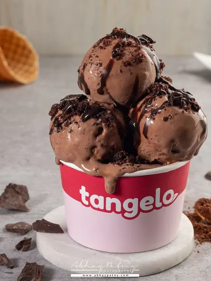 This shot of chocolate ice cream is for a healthy, low-sugar brand. The styling is clean and simple, letting the product's creamy texture do the talking without looking overly decadent.