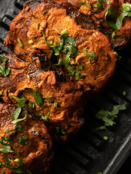 My Tandoori Mushroom Tikka is a tantalizing twist on a classic. Button mushrooms are stuffed with spiced cottage cheese and grilled to a crispy exterior.