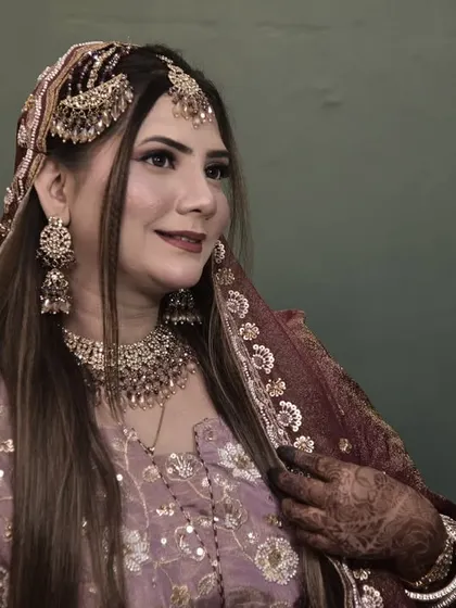 A happy, smiling bride. This shot captures the joy of the moment and the beauty of her complete look, from the makeup to the hair and jewelry.