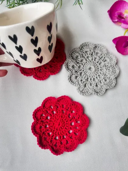 A beautiful arrangement of my red and grey mandala coasters. They are perfect for adding a touch of handmade charm to any surface.