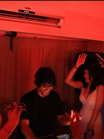 A candid shot from 'The White House Party'. Even in a house party setting, the vibe is pure club energy.