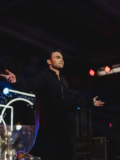 A portrait of the groom in his element, channeling his inner Bollywood hero during his solo dance.