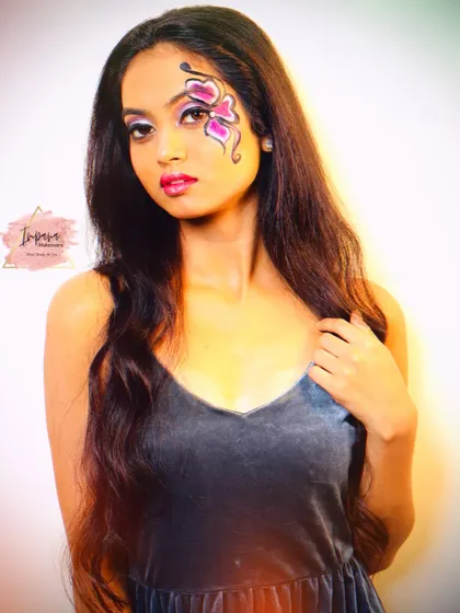 A full-face view of the creative butterfly makeup. This type of artistry pushes my skills and allows me to bring fresh, innovative ideas to my teaching.