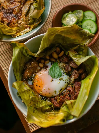 A signature dish from The Second House, Goa pop-up: a comforting rice bowl wrapped in a banana leaf, topped with a perfectly cooked egg.