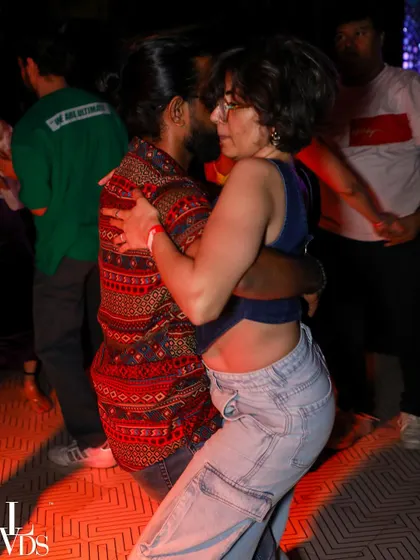 A sensual Bachata or Kizomba moment, with dancers in a close embrace, feeling the music.