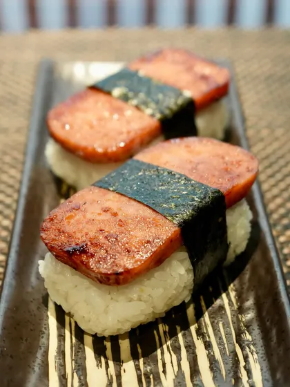 Introducing Supamu Nigiri, a playful Okinawan twist on traditional nigiri. Made with seared Spam on seasoned rice and wrapped in nori, it brings together sweet, salty, and savory in every bite. A nostalgic street-food favorite from Japan’s southern islands.