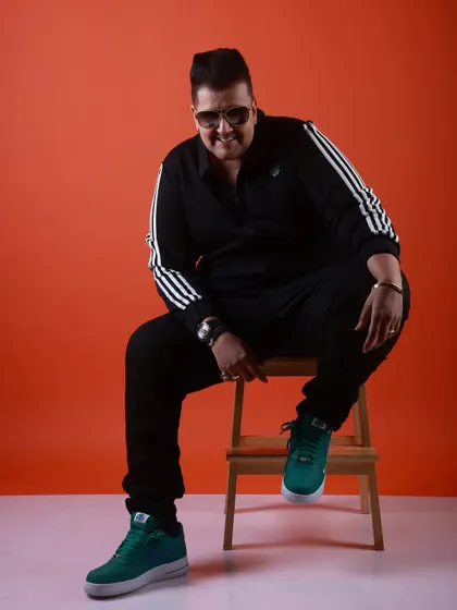 A full-length shot from my modeling session. The sporty tracksuit and bright sneakers show off my more casual, urban style.