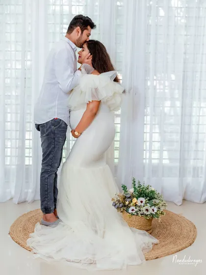 A tender forehead kiss, a classic expression of love and care. This intimate moment is beautifully captured in our bright and airy studio.