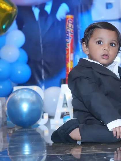 The star of the show. The birthday boy looks sharp in his little suit at his Boss Baby themed first birthday party, ready for his close-up.