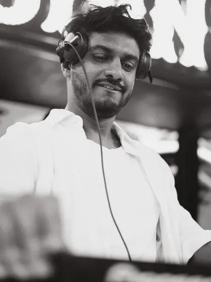 A black and white portrait from my set at Club Illusions. This timeless shot captures a moment of quiet focus and satisfaction.