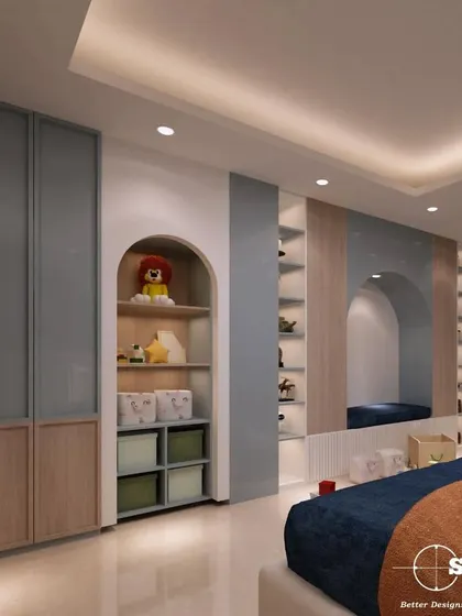This view of the kid's bedroom highlights the smart storage solutions we integrated. It includes arched niches for toys and books, along with sleek, dual-toned wardrobes.