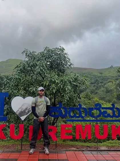 Posing at the iconic "I Love Kudremukh" sign. It's a must-do photo stop for everyone who visits.