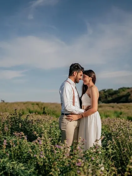 A quiet moment of connection, forehead to forehead, in the middle of a vast field. It feels like they are the only two people in the world.