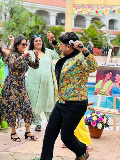 Dancing with the guests at a pool party. My approach is always hands-on; I get off the stage and join the crowd to make sure everyone feels the energy.