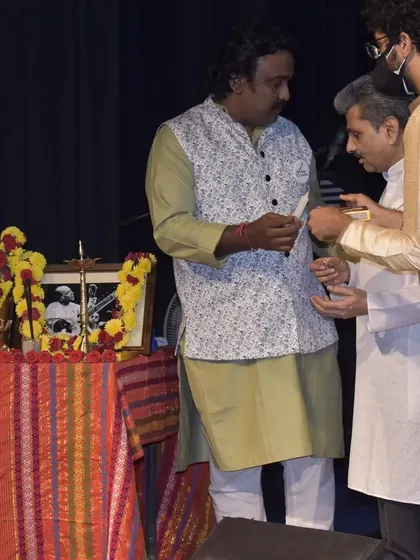 A moment of paying respects during the Gurupoornima ceremony. This day is about honoring the lineage of teachers who have passed down this knowledge.