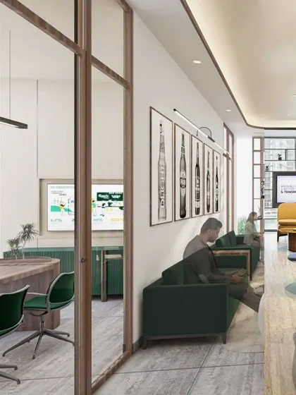 This render shows a breakout area adjacent to a meeting room. The design uses comfortable, residential-style furniture and a rich color palette to create a relaxed atmosphere for informal collaboration or a quiet break.