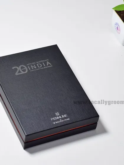 The elegant black gift box for the Applied Materials India 20th anniversary diary. The sophisticated packaging enhances the perceived value of the gift inside.
