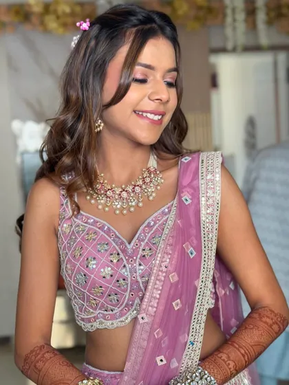 A beautiful, natural smile. This hairstyle is perfect for enjoying a long day of wedding festivities.