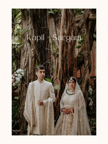 A stately portrait of the couple. They stand before a massive, ancient-looking tree, which provides a dramatic and powerful backdrop to their elegant wedding attire.