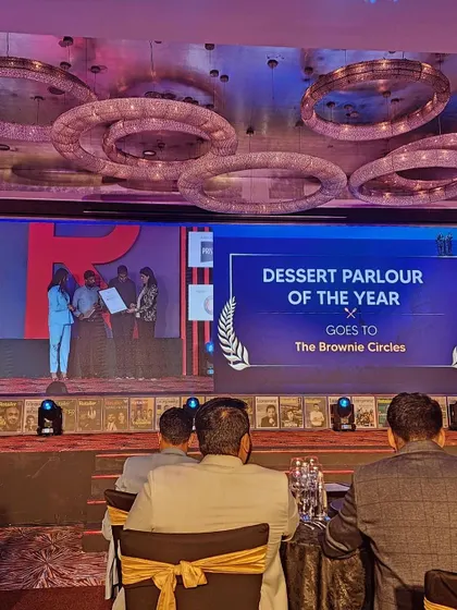 A proud moment for our team, accepting the award for "Dessert Parlour of the Year." This is a testament to our team's hard work and our customers' loyal support.