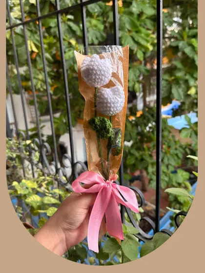 Another look at the "Hugging Tulips" bouquet, a popular choice for a simple, elegant gift. Each tulip is carefully crafted to capture the flower's classic shape, creating a piece of decor that is both minimalist and charming.