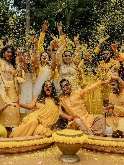 The grand entrance with colorful smoke bombs makes for an epic start to the Haldi festivities. We love capturing the energy and excitement of the wedding party.