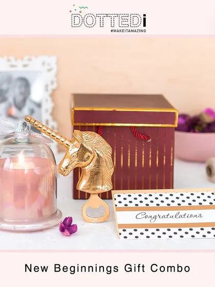 This "New Beginnings" gift combo is perfect for celebrating a milestone. It includes a unicorn bottle opener, a scented candle under a glass cloche, and a "Congratulations" card.