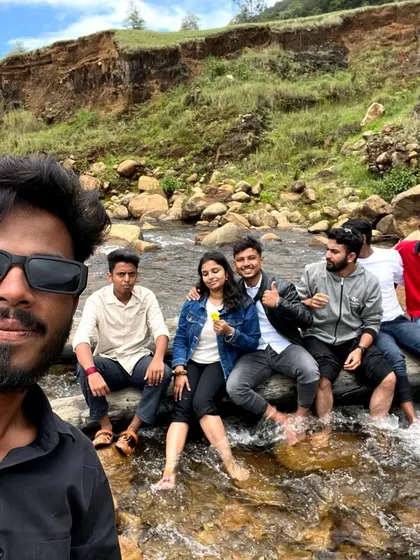 The group taking a break by a stream, dipping our feet in the cool water. These are the refreshing moments that make a trip special.