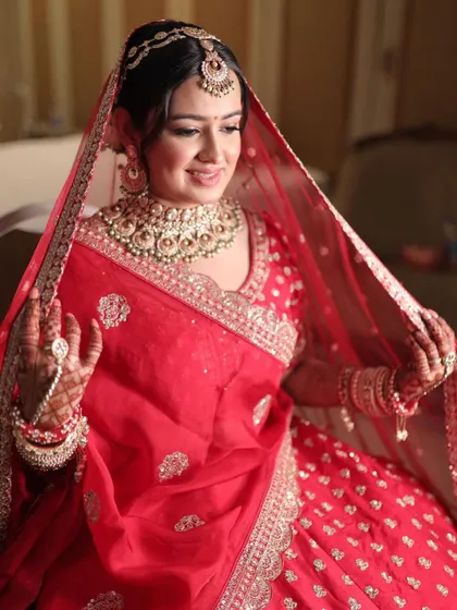 A candid shot of Krusha getting ready. Her bridal makeup looks flawless even in the moments before the final reveal.