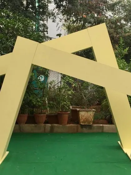 Here, the two sloping box panels are arranged to form a unique, interlocking geometric shape. This demonstrates the versatility of our props in creating custom looks for any contemporary event theme.