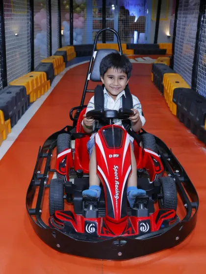 A big smile from a happy racer. Our go-karting experience is consistently one of the biggest highlights for our visitors.