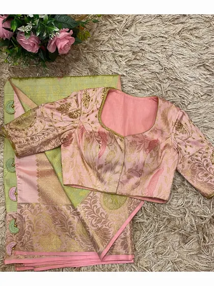 The front of the pink and green blouse, showing how the colors and patterns complement the saree perfectly.