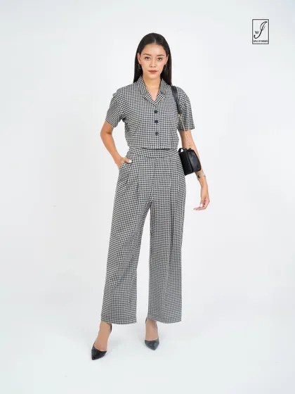 The same outfit styled with a handbag, showing its versatility for a professional or smart-casual setting.