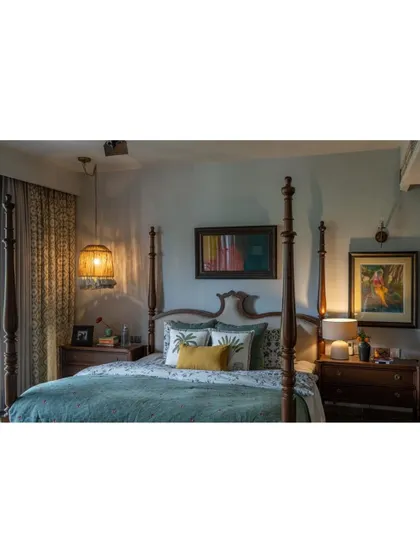 A cropped version of the Dhaka master bedroom, focusing on the cozy and cultured vibe. The image highlights the mix of textures and the warm, inviting color palette.