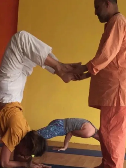 A demonstration of partner work to deepen asana practice. Working together allows students to explore new possibilities in their postures with support.