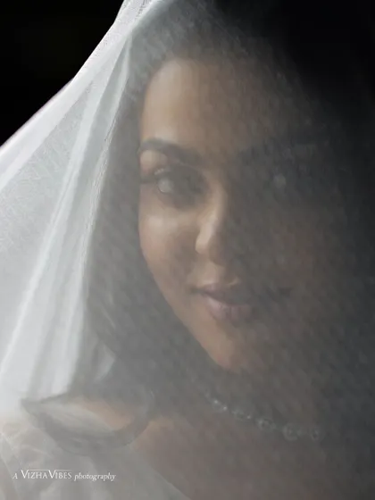A creative shot of a model with a white veil, creating a beautiful and artistic Christian wedding portrait.